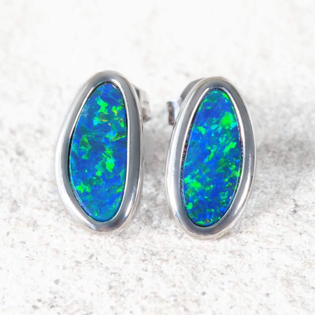australian opal earrings with blue and green colur set in whute gold