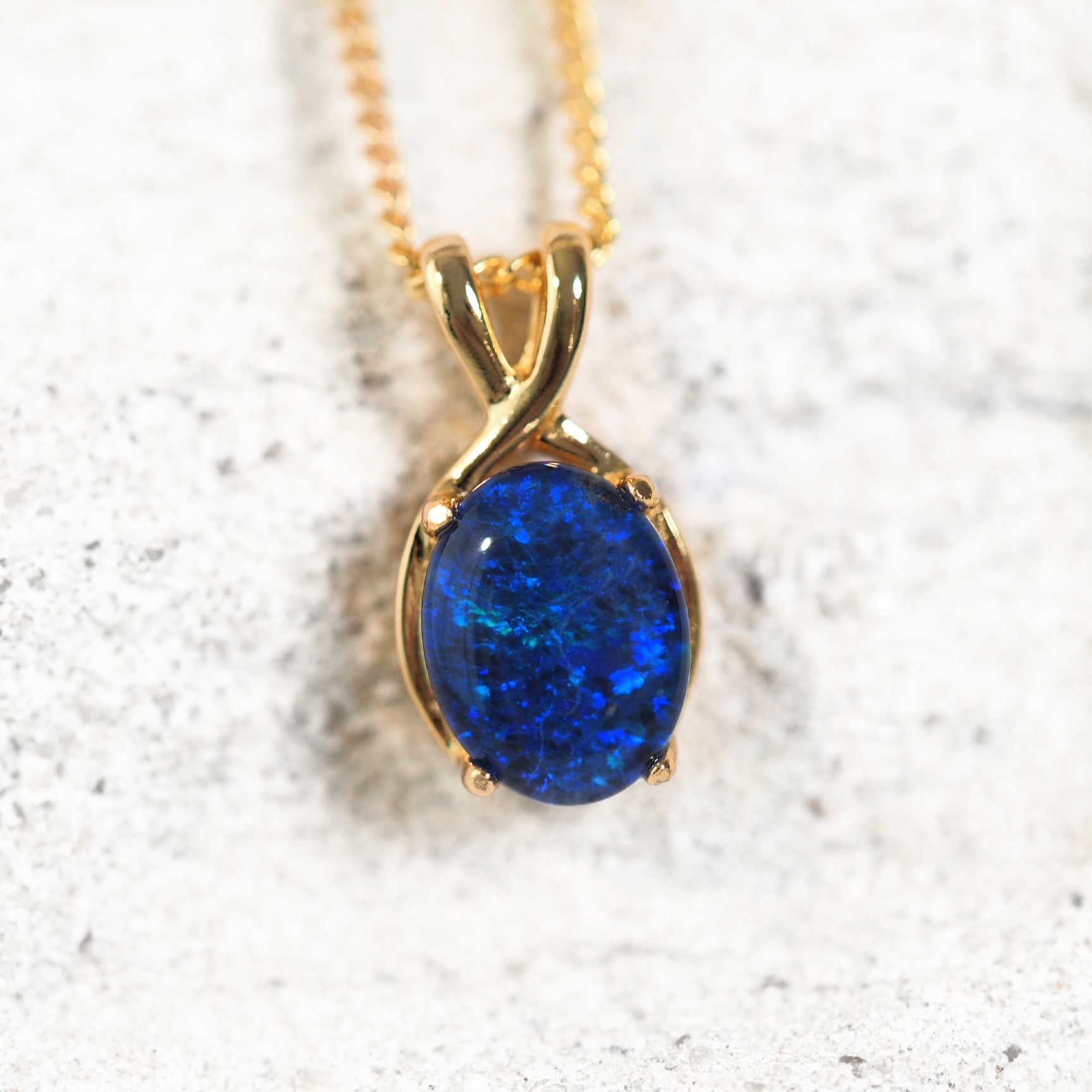 Gold plated silver pendant with oval blue and green Australian triplet opal.