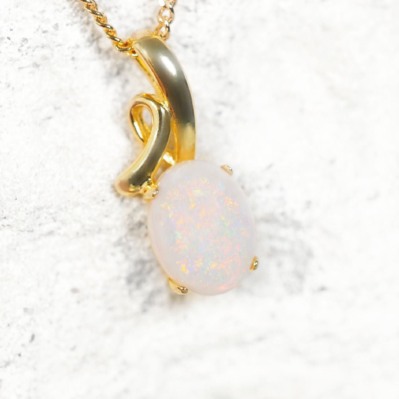 Elegant decorative gold-plated silver necklace pendant featuring South Australian solid white opal with vibrant play-of-colour