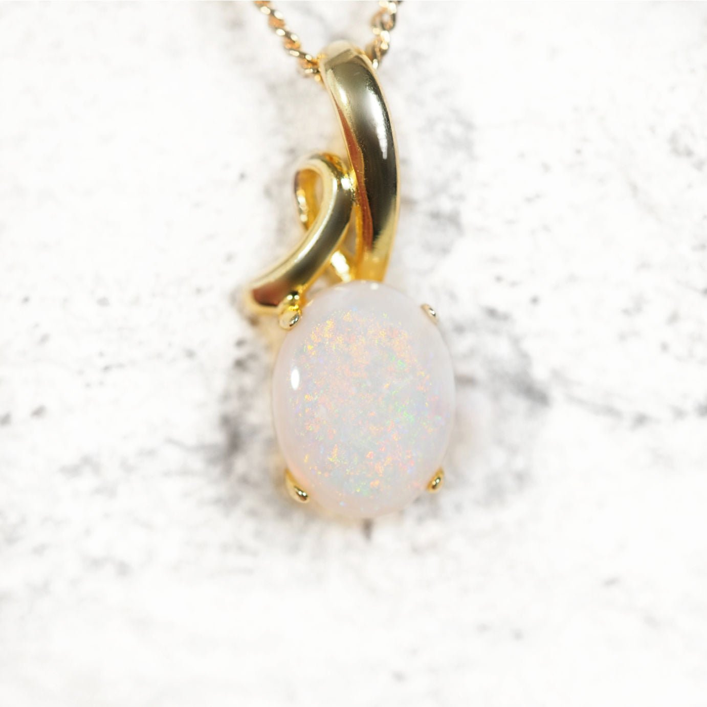 ‘Layla’ gold-plated sterling silver opal pendant with claw-set oval South Australian solid white opal in multi-coloured tones