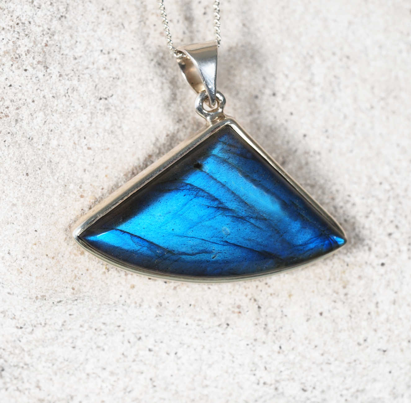 Elegant Labradorite necklace in silver setting with glowing blue tones