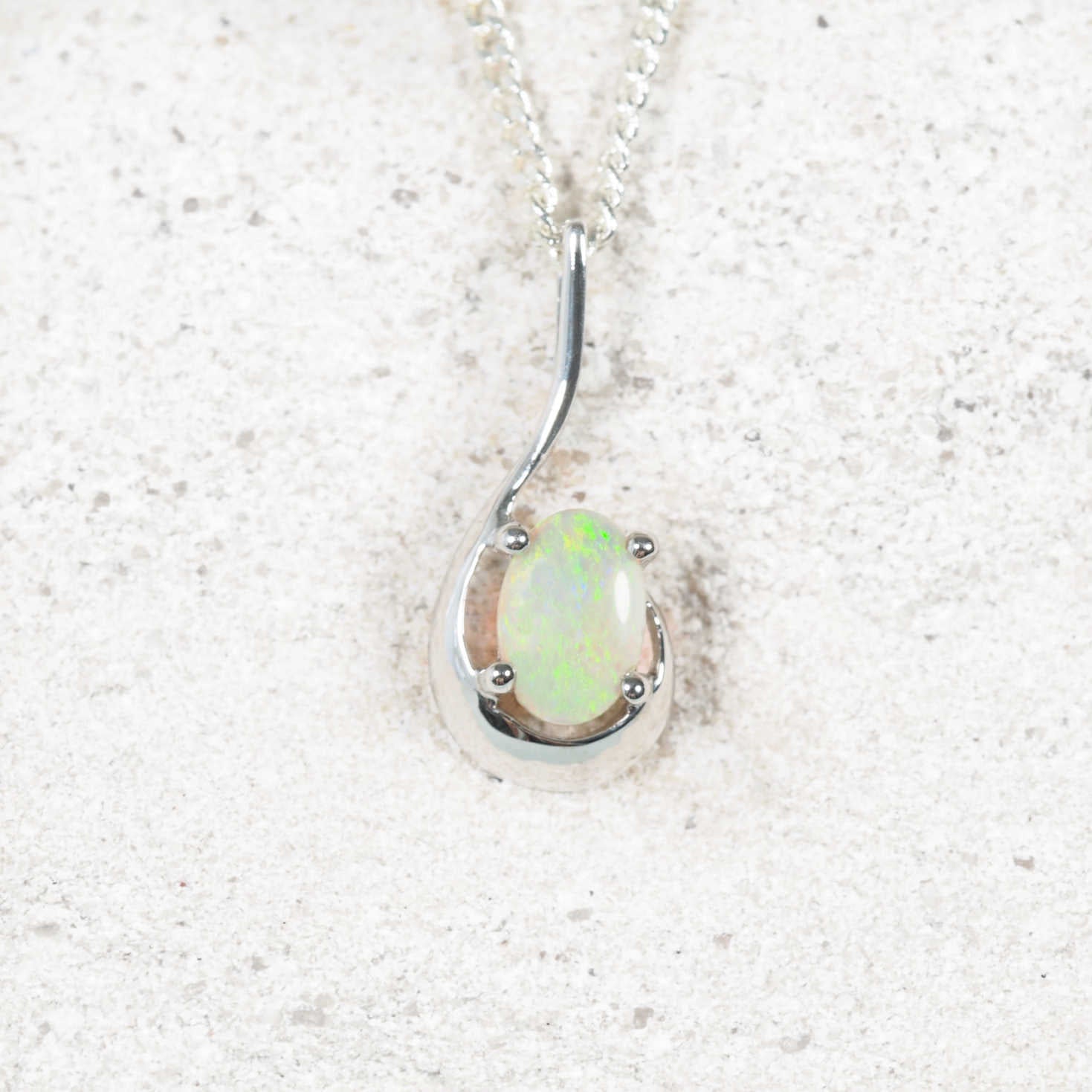 green opal pendant set in 9ct white gold