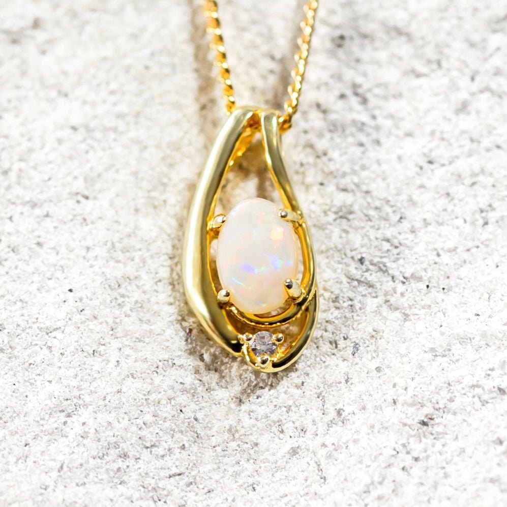 oval opal pendant set in gold plated silver