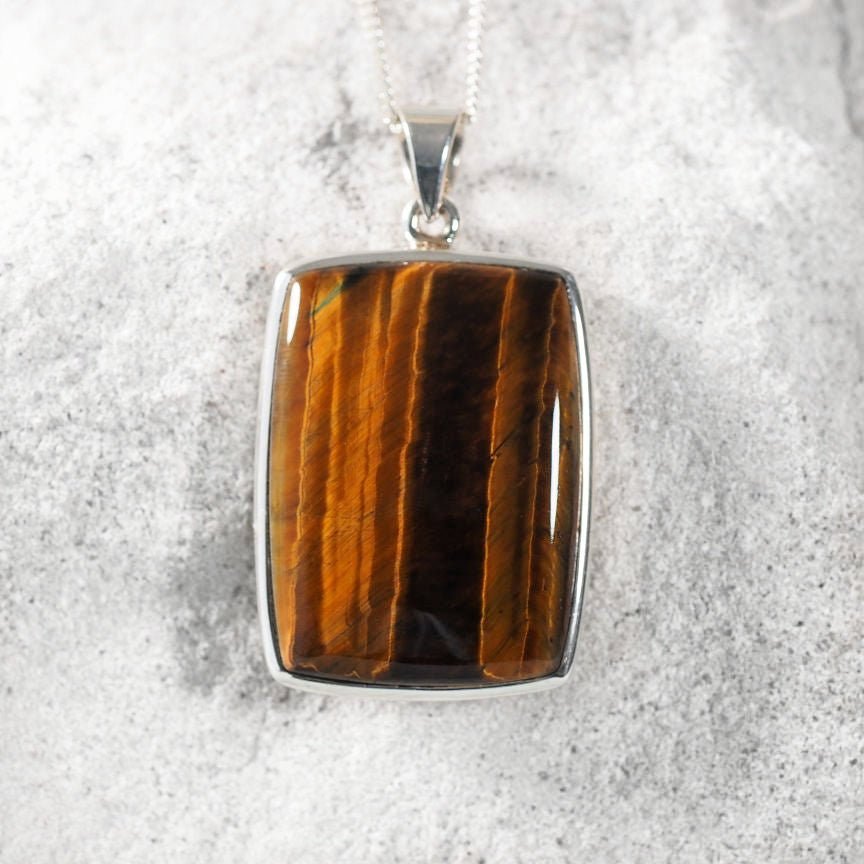 Lila pendant featuring polished brown Tiger’s Eye in a silver setting