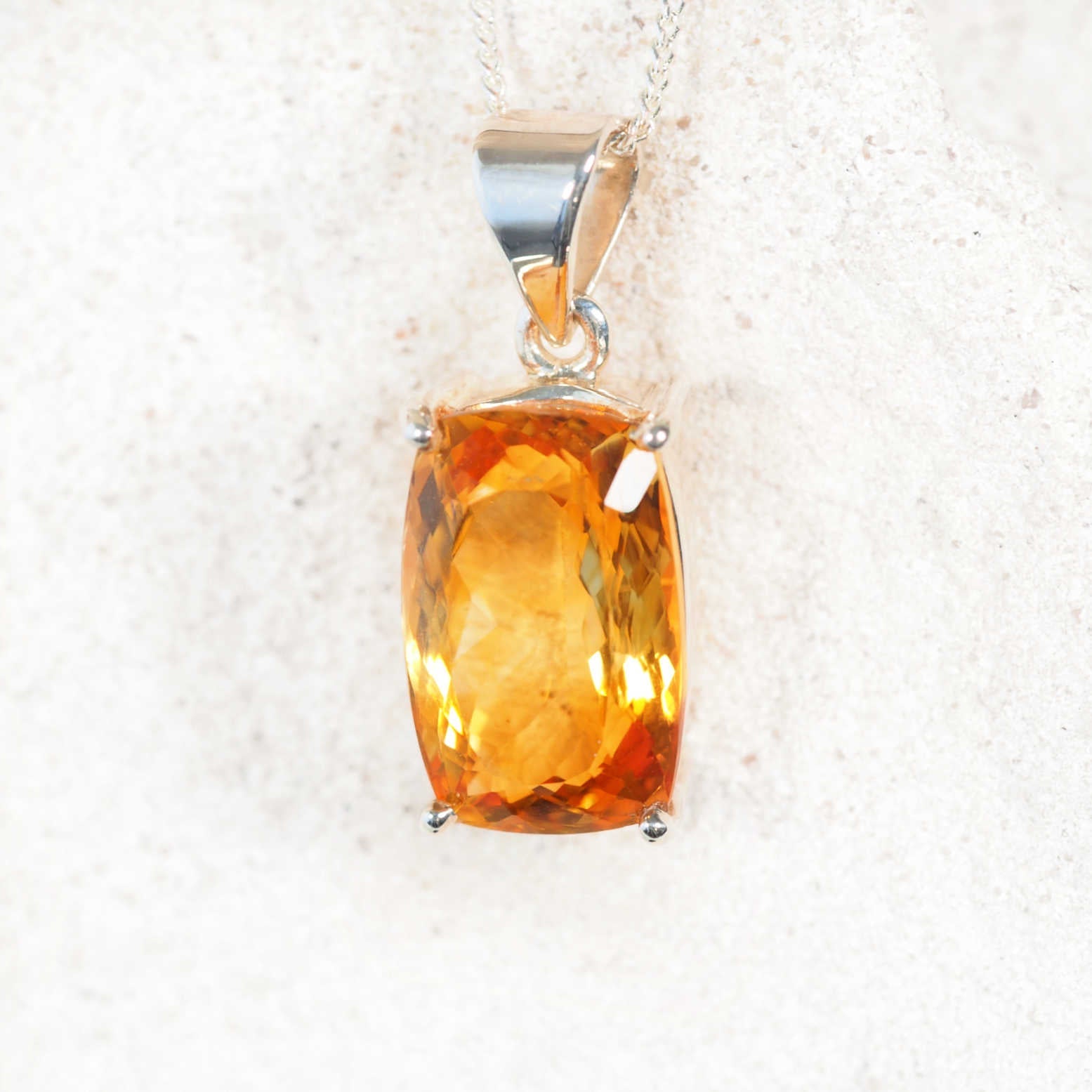 'Liora' square Citrine pendant in silver, displaying warm golden-yellow tones with faceted brilliance.