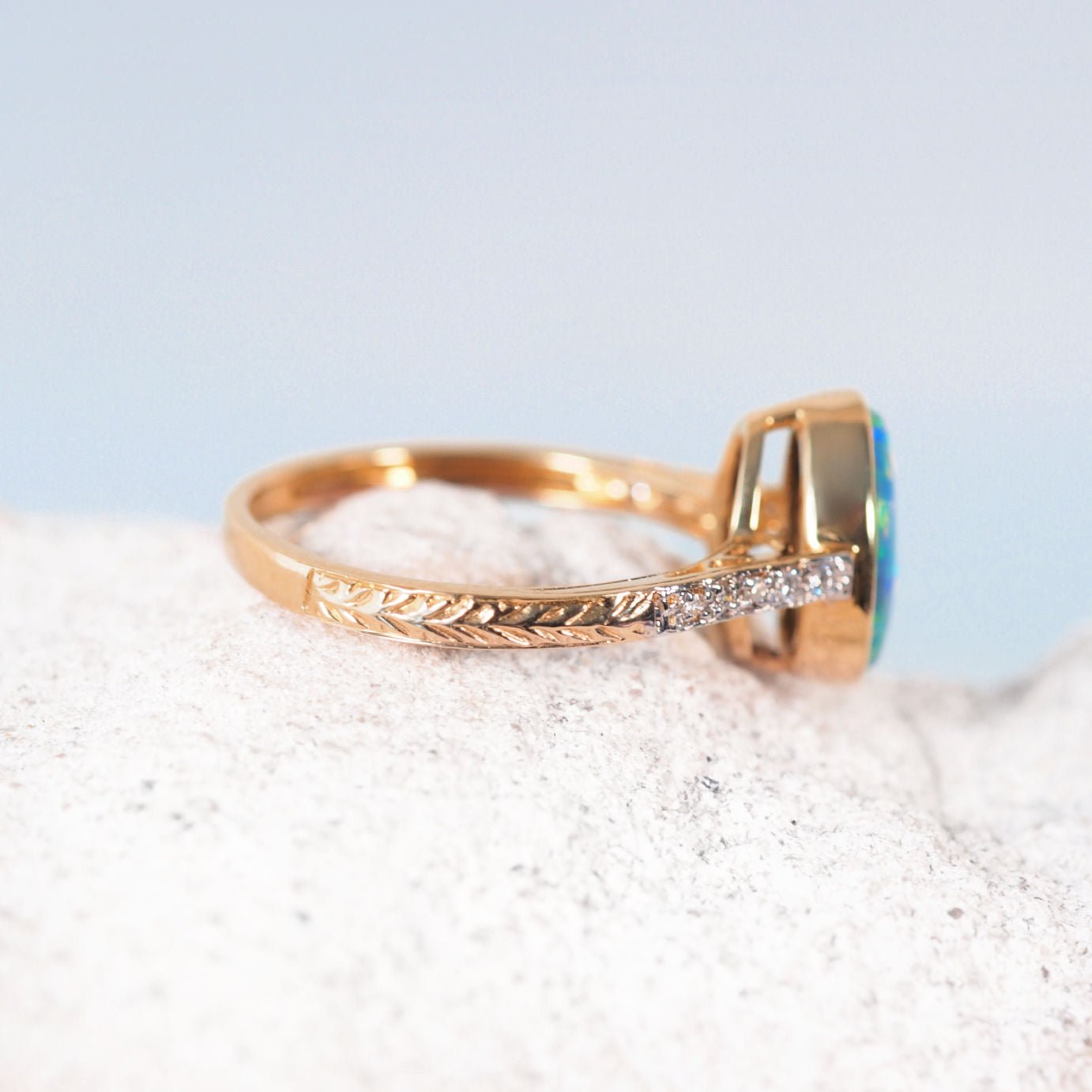 Luxury Liora opal ring crafted in 14ct yellow gold with oval-shaped Australian doublet opal and diamonds