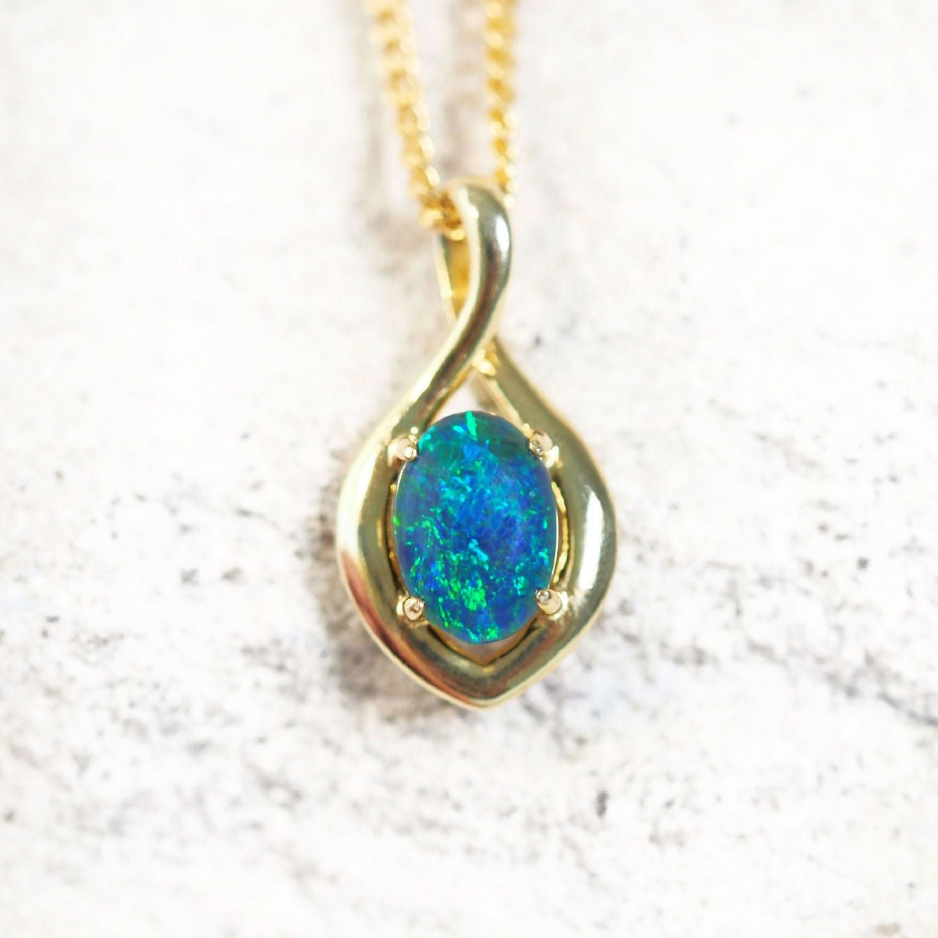 blue and green triplet opal pendant