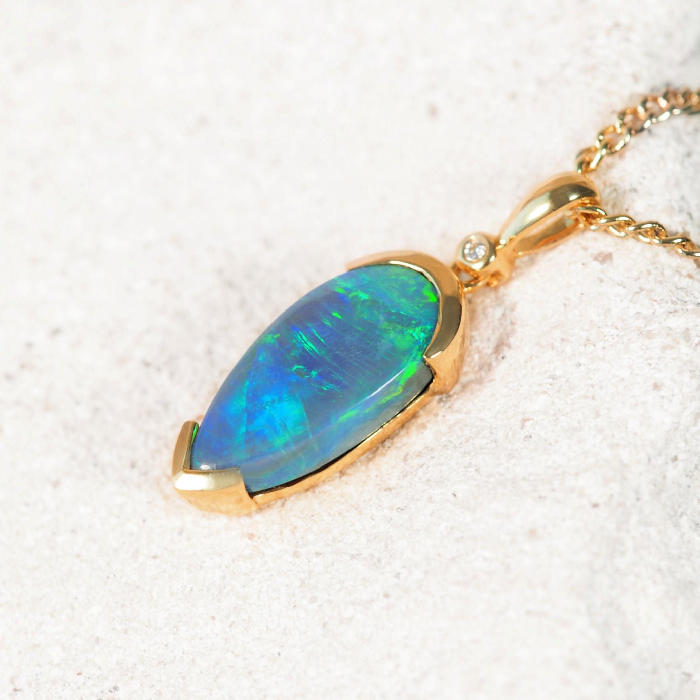 'Loren' 18ct yellow gold black opal pendant with green Lightning Ridge opal and diamond