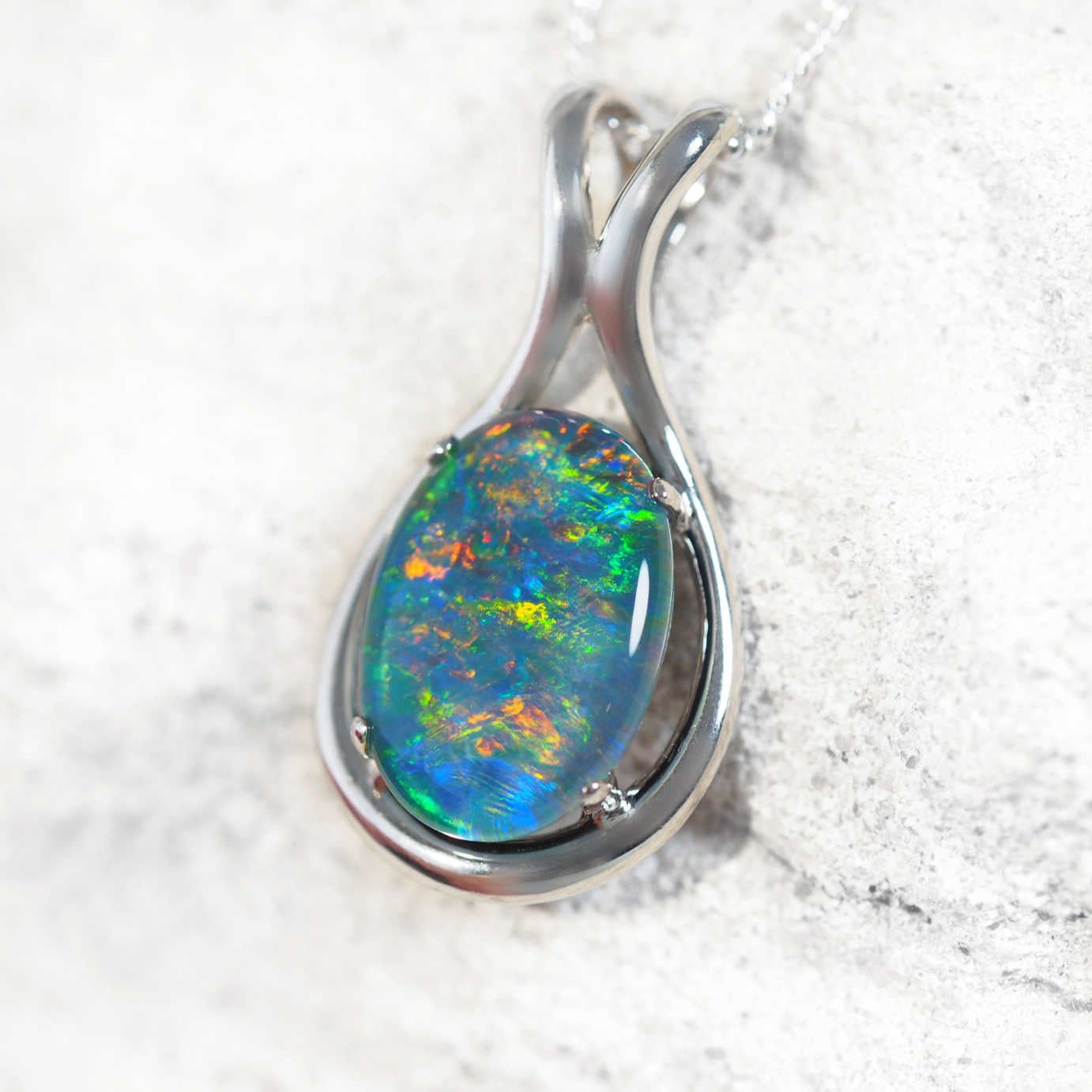 Elegant sterling silver opal necklace pendant featuring claw-set multi-coloured Australian triplet opal