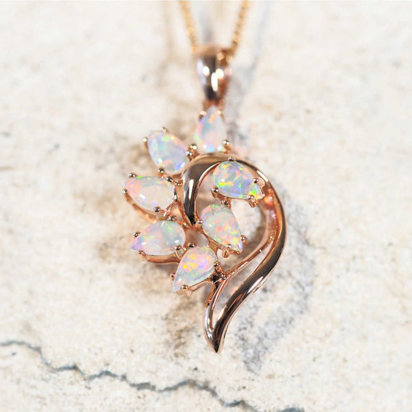 rose gold opal necklace set with seven multi-coloured stones