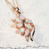 rose gold opal jewellery piece set in a 14ct gold pendant with seven stones