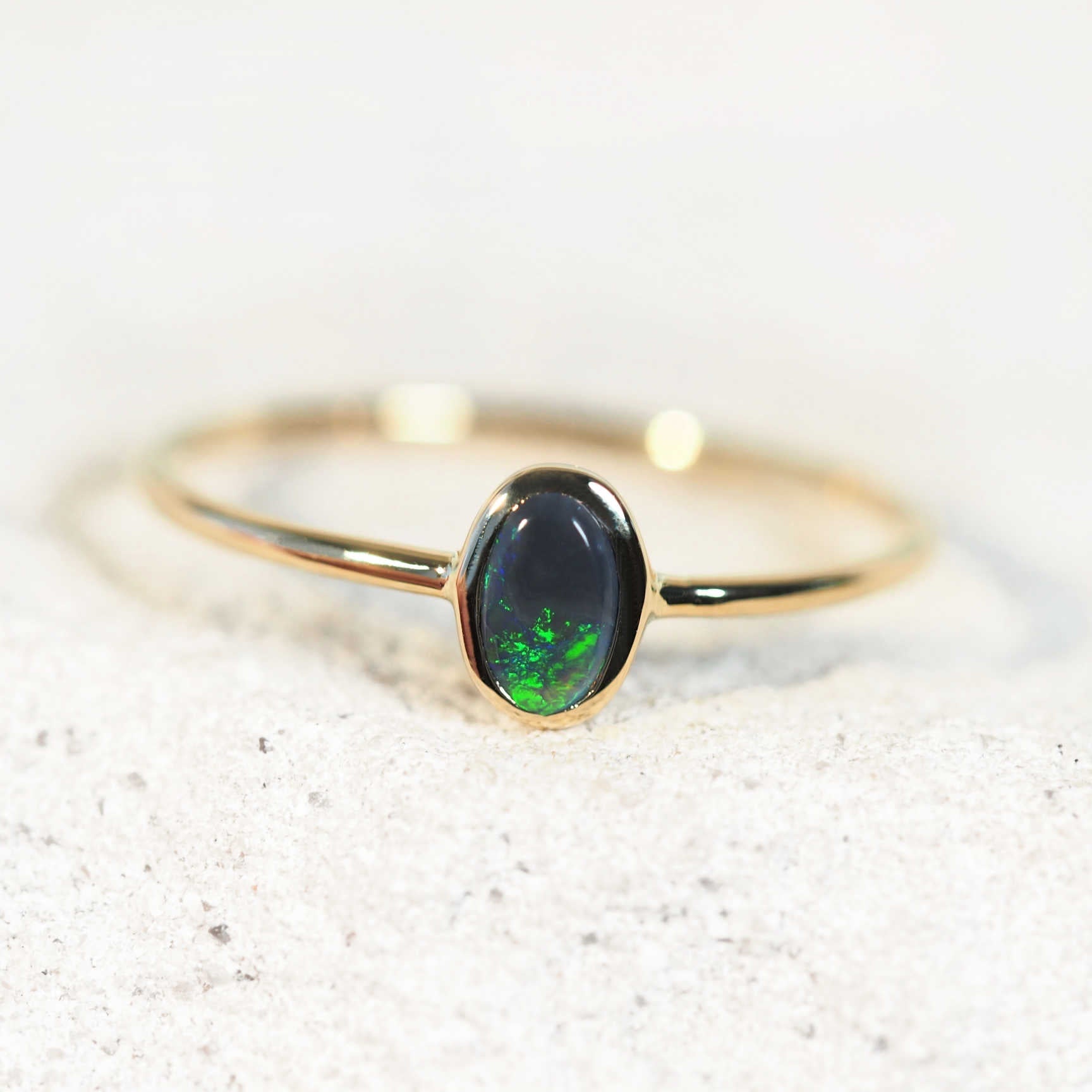 Delicate 14ct gold ring with oval green black opal from Lightning Ridge