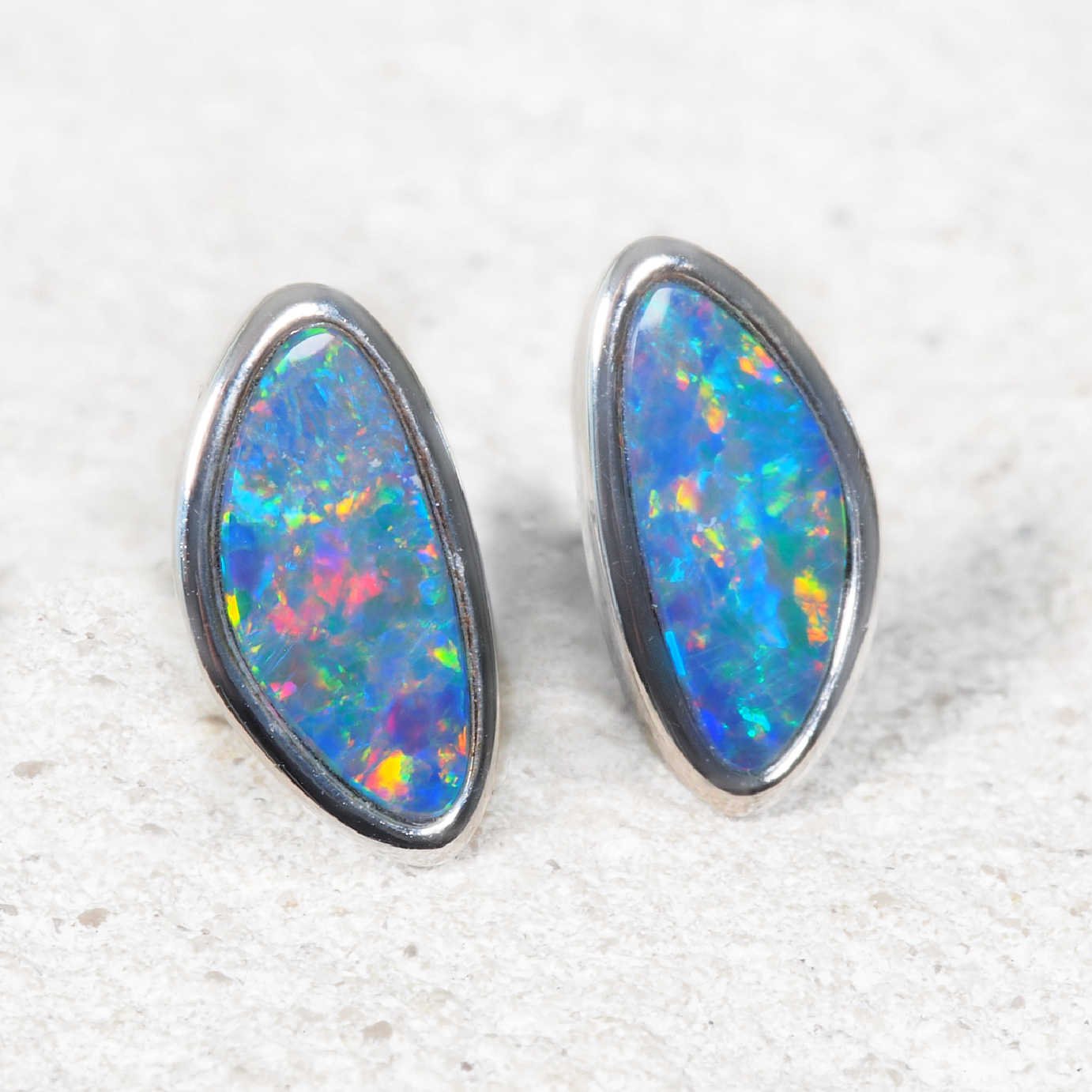 Multi-colour opal earrings set into sterling silver bezel settings 