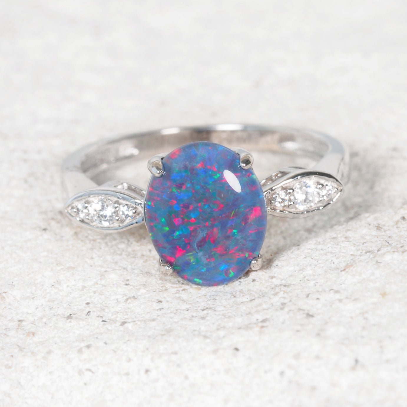 Silver opal ring with a multi-colour stone