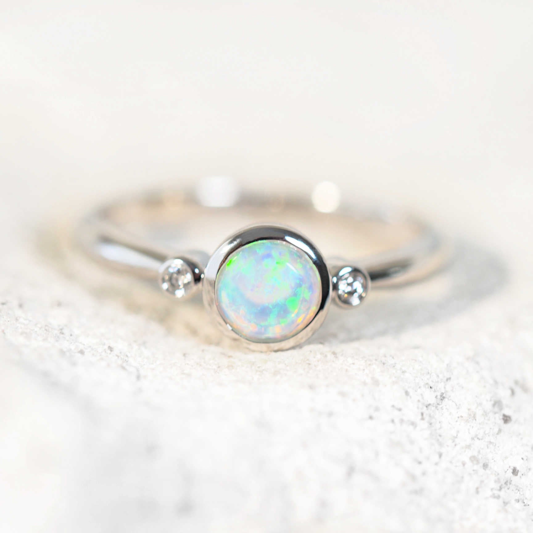 Delicate white gold opal ring featuring Lightning Ridge crystal opal