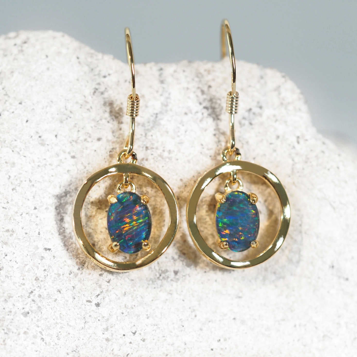 Unique drop earrings set with colourful Australian triplet opals by Black Star Opal