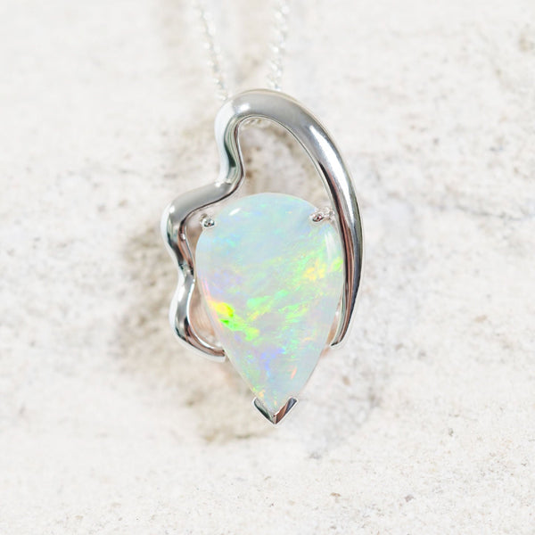 opal pendant set with a colourful white opal in 14ct white gold