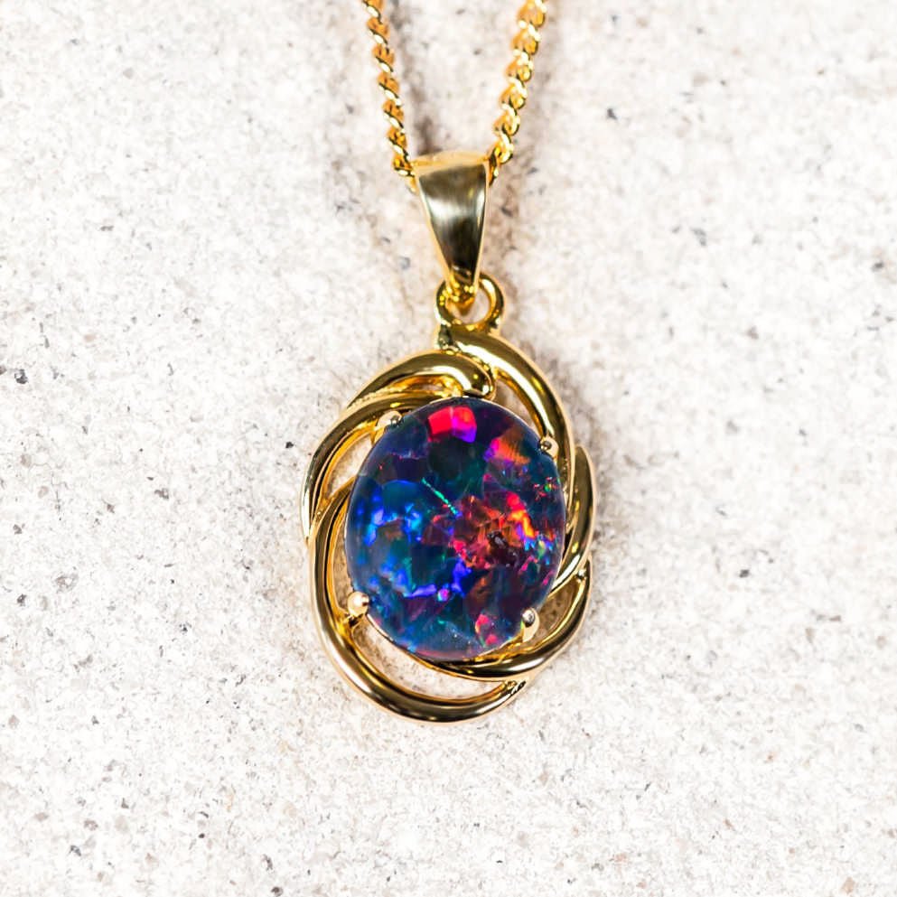 colourful opal pendant set in gold plated silver