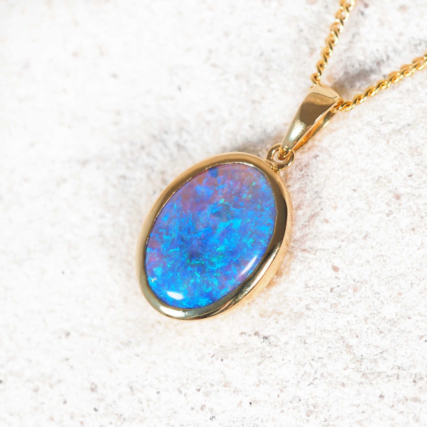 Australian solid crystal opal pendant in 18ct gold by Black Star Opal