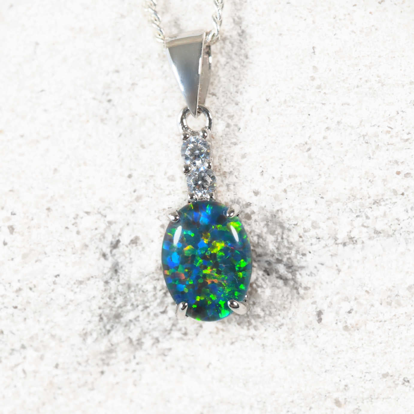 Elegant sterling silver statement opal necklace pendant featuring a blue and green Australian triplet opal topped with sparkling diamantés