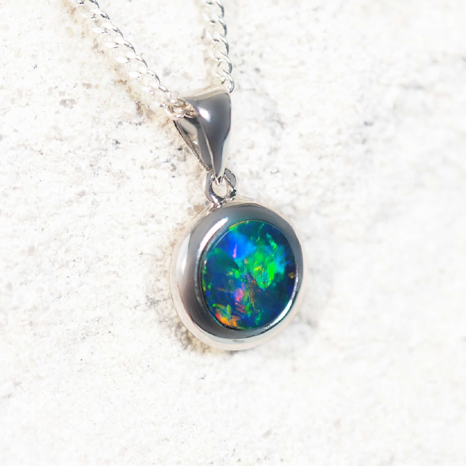 ‘Nania’ 14ct white gold opal pendant – round Australian doublet opal with vivid blue and multi-colour play-of-colour by Black Star Opal
