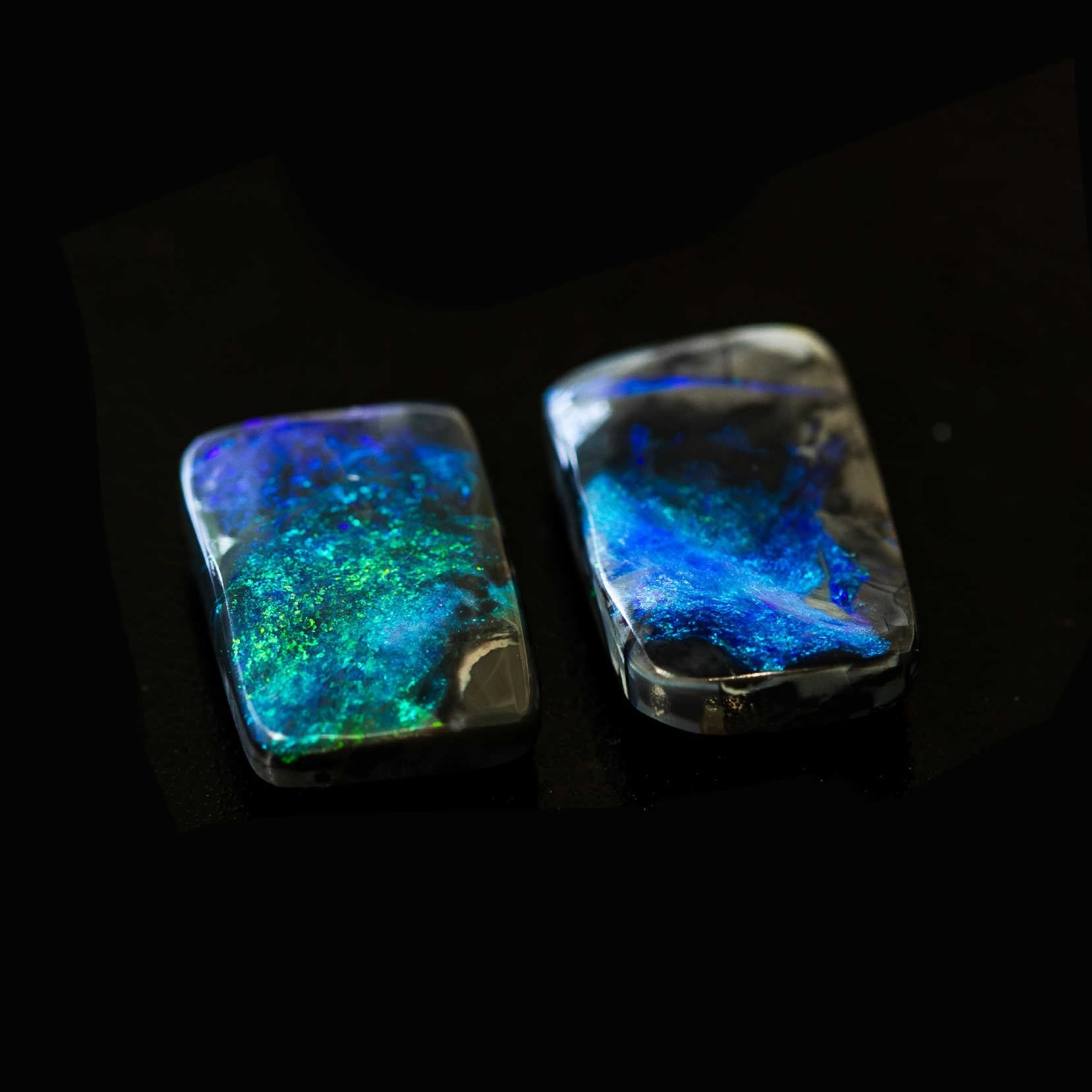 Rectangular Australian black opals with vivid blue-green fire from Lightning Ridge