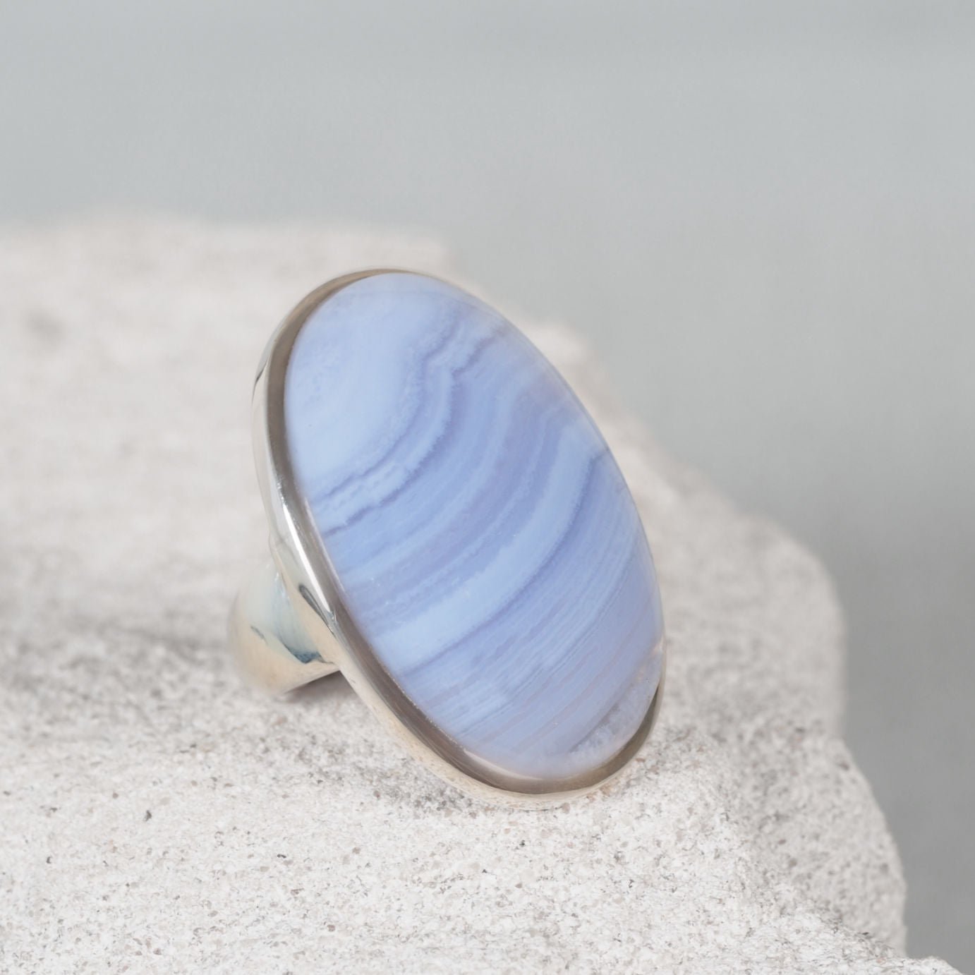 Blue lace agate ring in a silver oval shape designed in silver bezel setting 