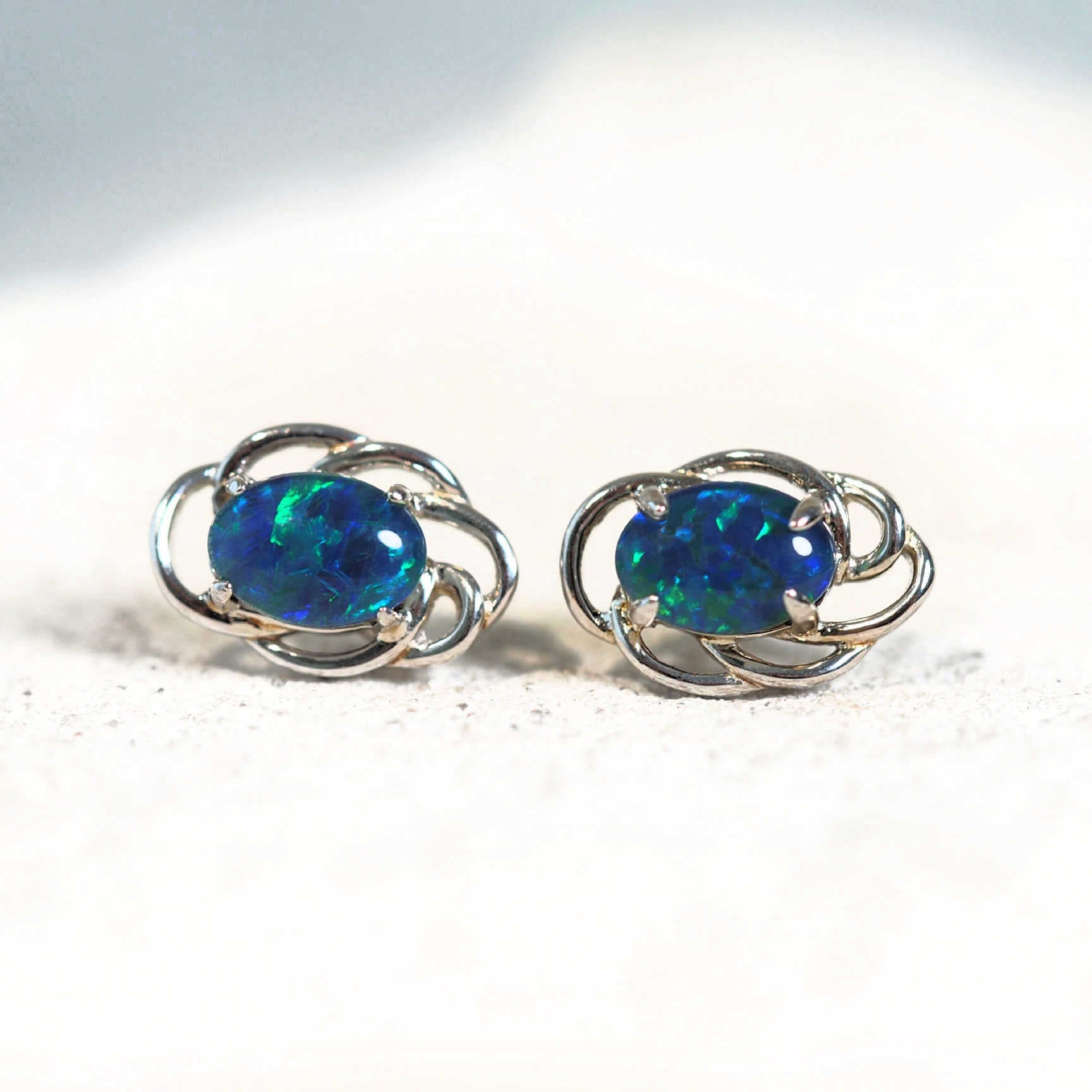 blue and green oval opal earrings
