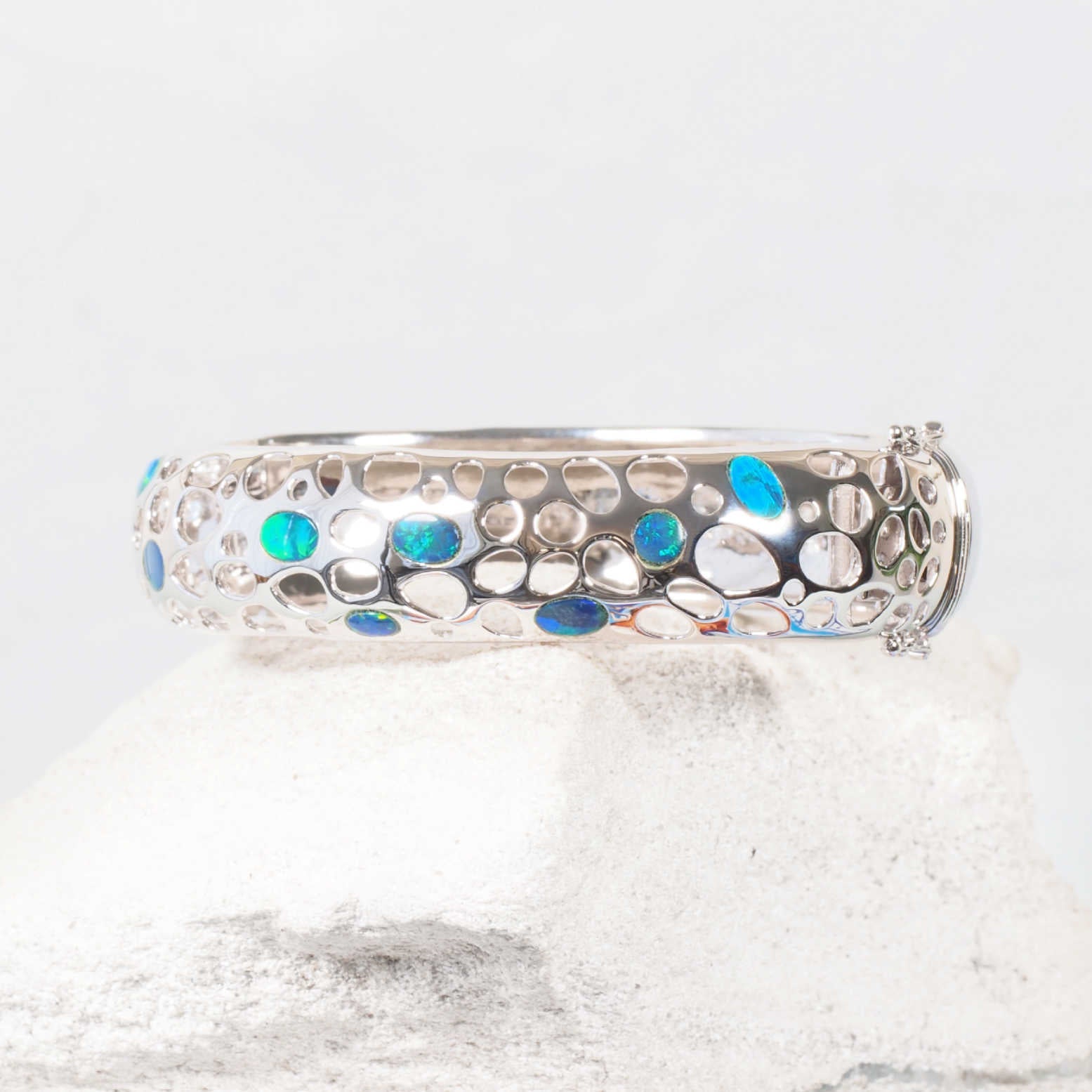 Sterling silver opal bangle with nine blue and green Australian doublet opals – ‘Nova’