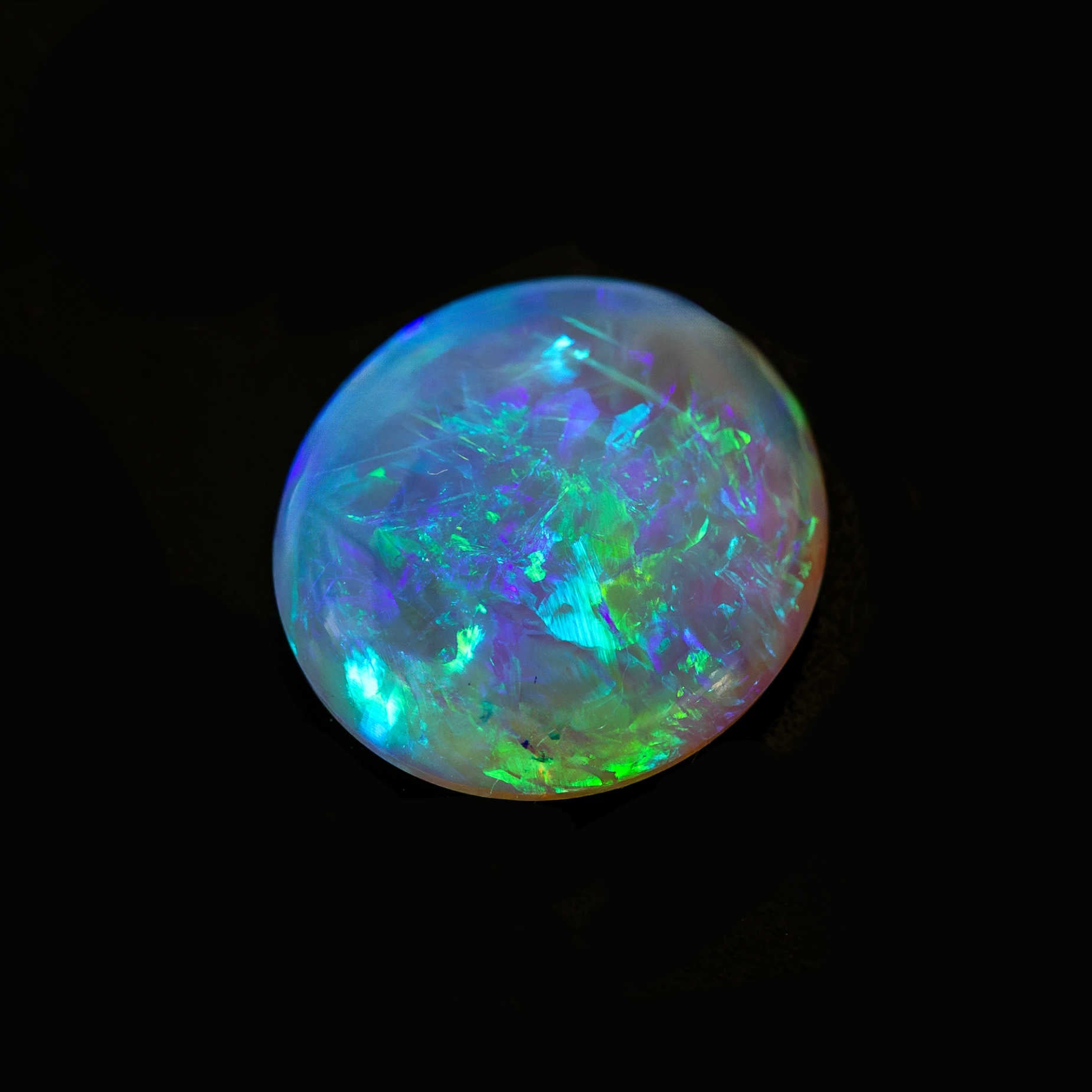 Oval-shaped blue and green crystal opal from Lightning Ridge