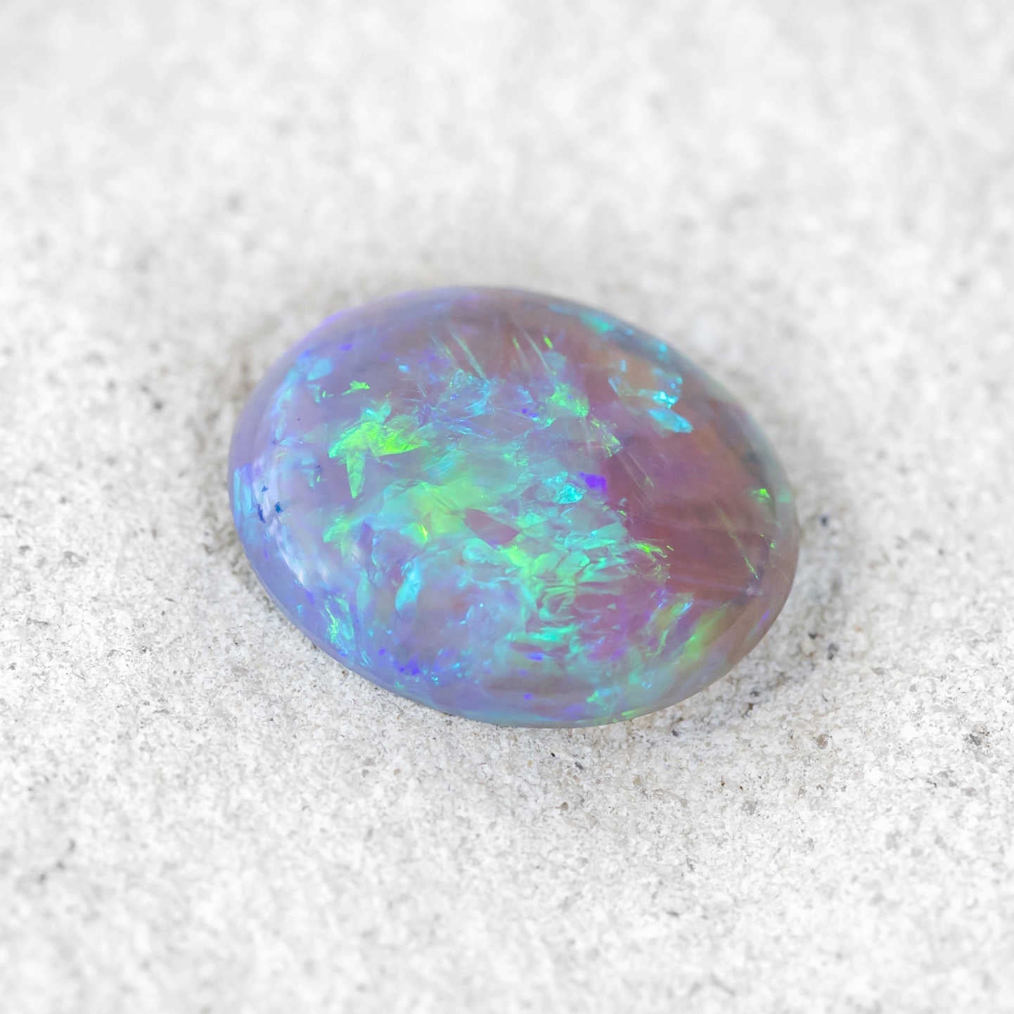 Natural Australian opal with vibrant play-of-colour in blue and green