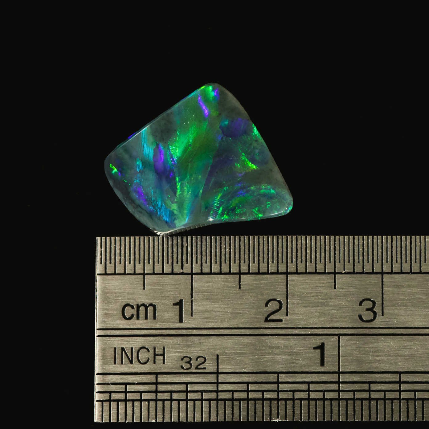 Close-up of Ocean Stingray opal displaying shimmering play-of-colour