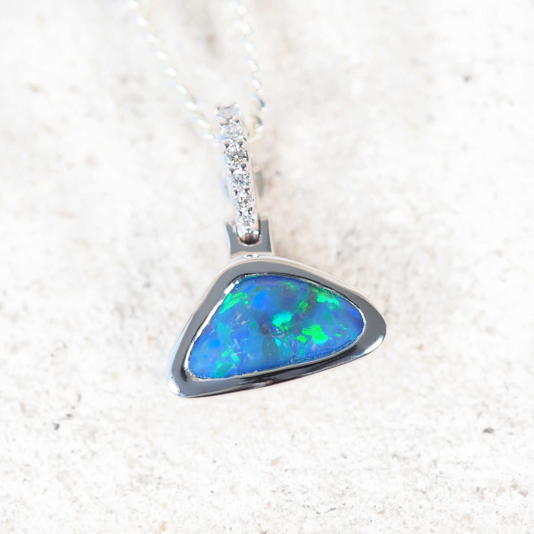 'Oceana' black opal pendant in 18ct white gold with triangular Lightning Ridge opal and diamonds