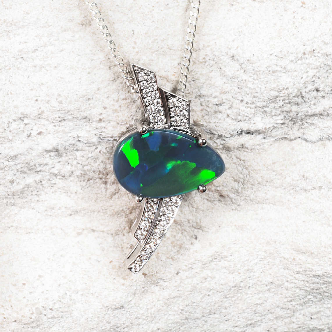 Lightning Ridge black opal pendant showing vivid green and blue fire