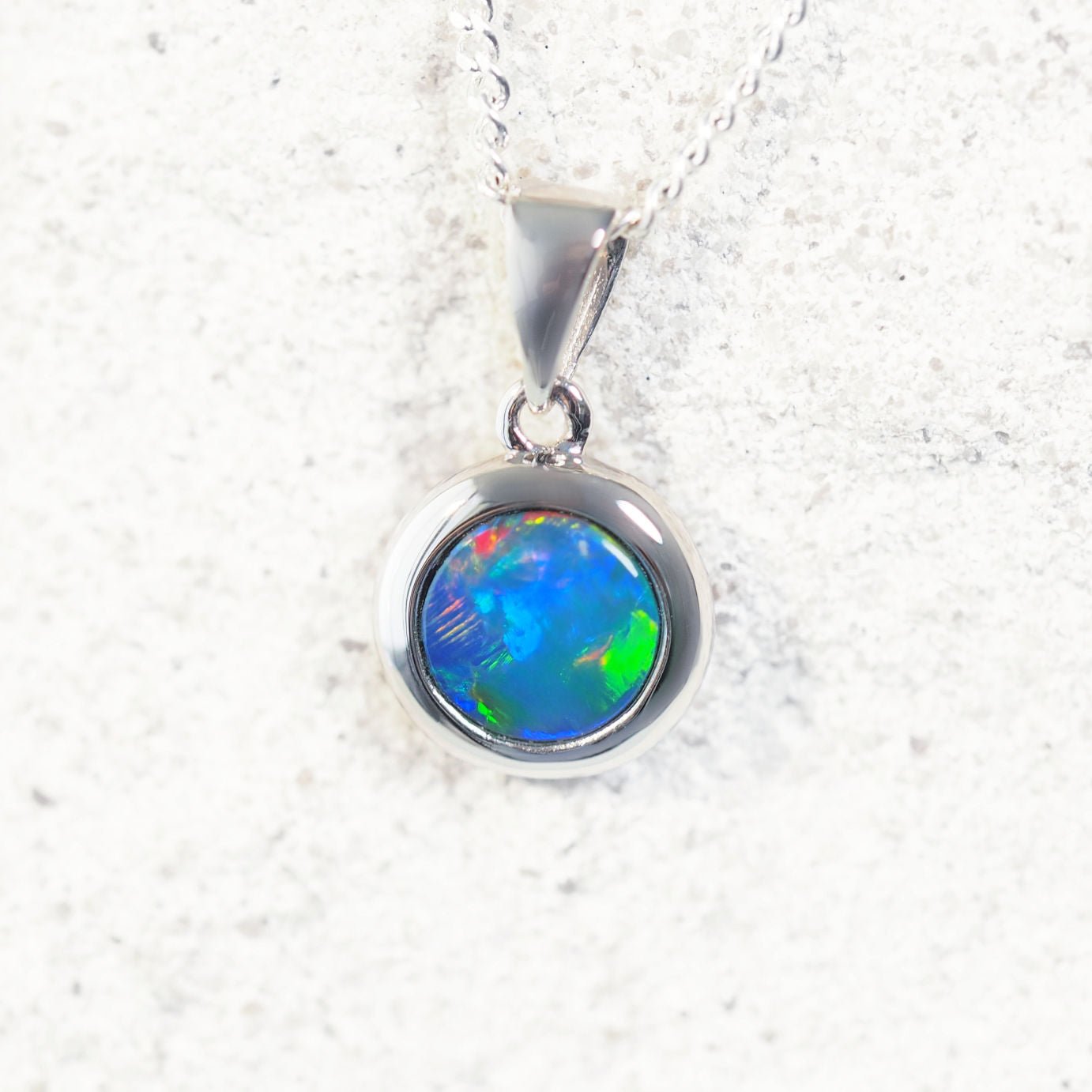 ‘Pria’ 14ct white gold opal pendant – round Australian doublet opal with vivid multi-colour play-of-colour by Black Star Opal