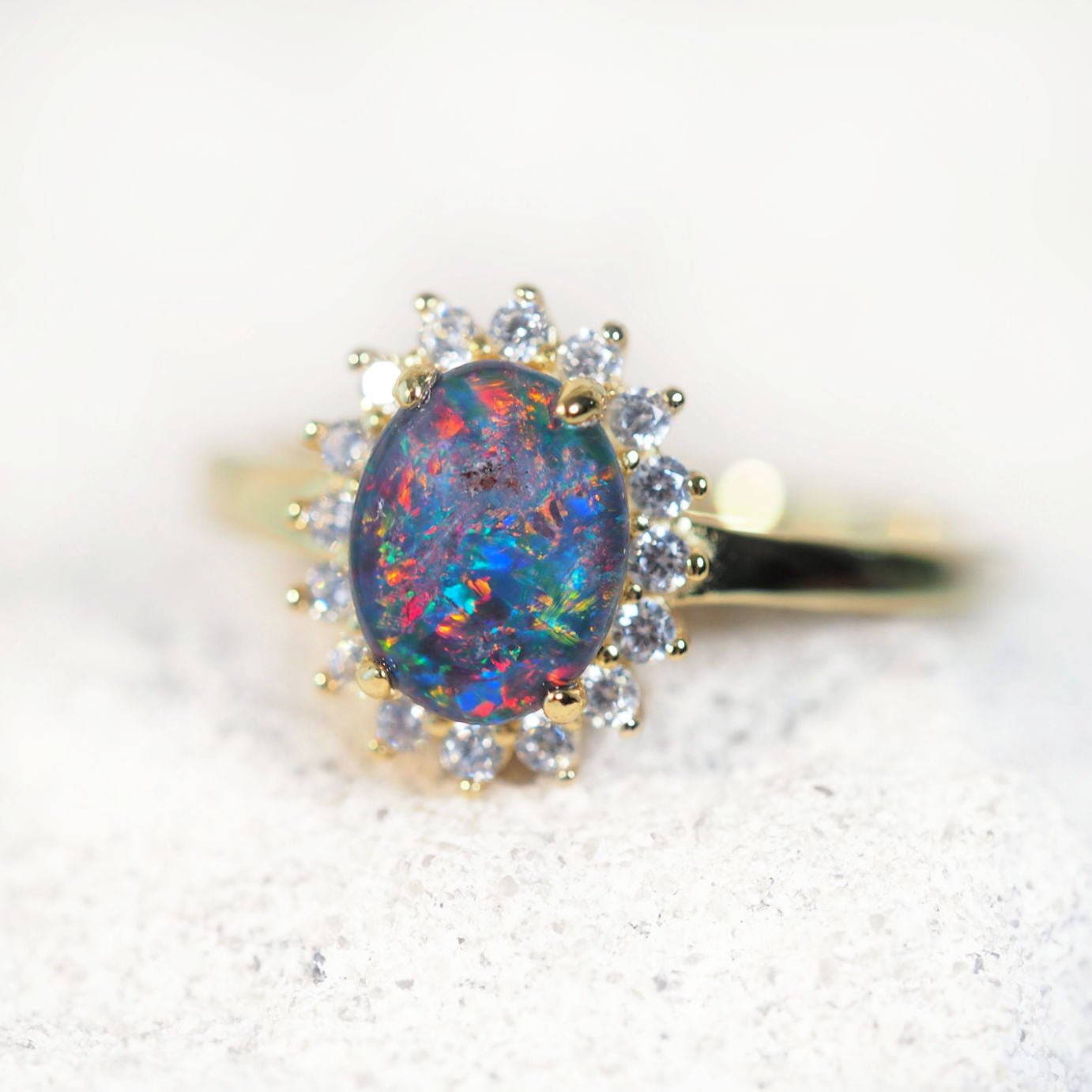 multi-colour opal ring set in gold plated silver with diamantes