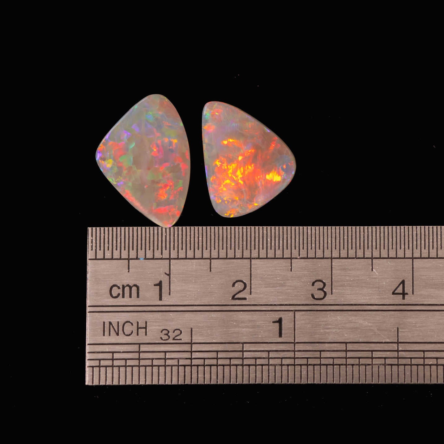 Ethically sourced Lightning Ridge black opals in triangular shape