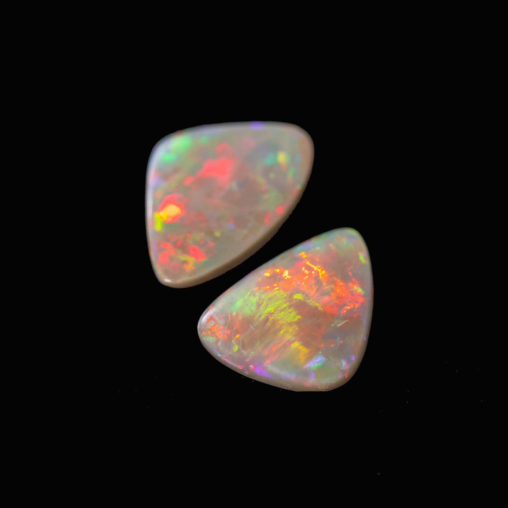 Prism Flame black opals showcasing flashes of red, green, and blue
