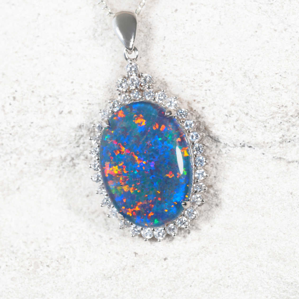 ‘Radiance’ sterling silver opal pendant with claw-set oval Australian triplet opal surrounded by 34 diamantés