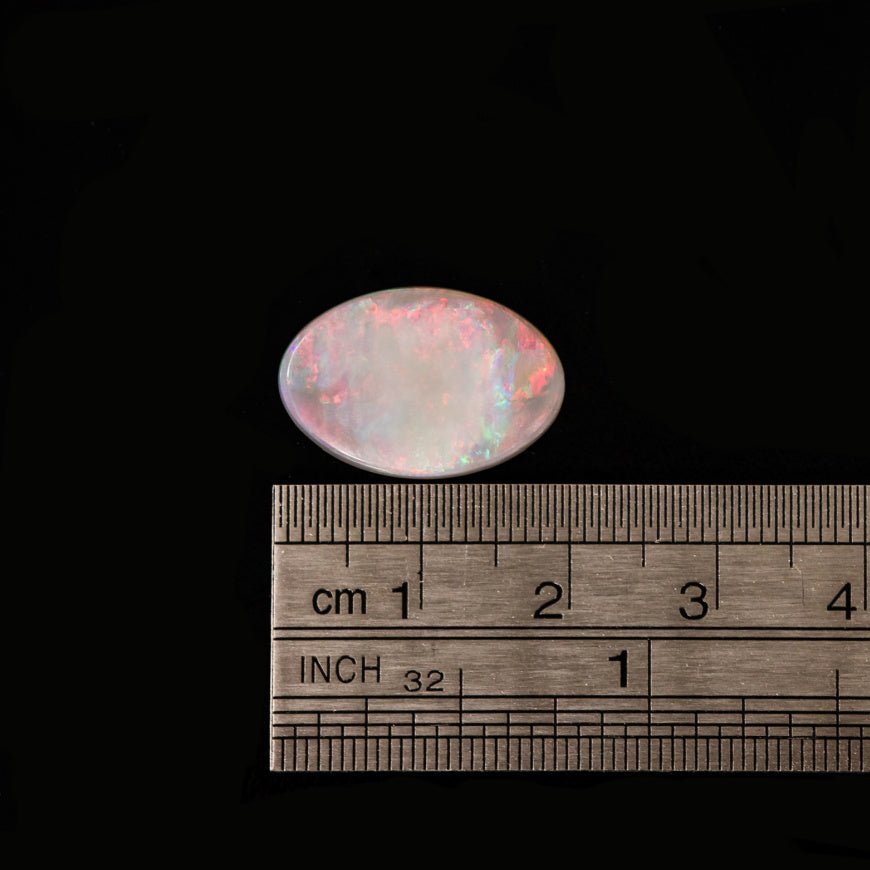 Rainbow Cloud natural opal displaying red, blue, green, pink, and orange hues