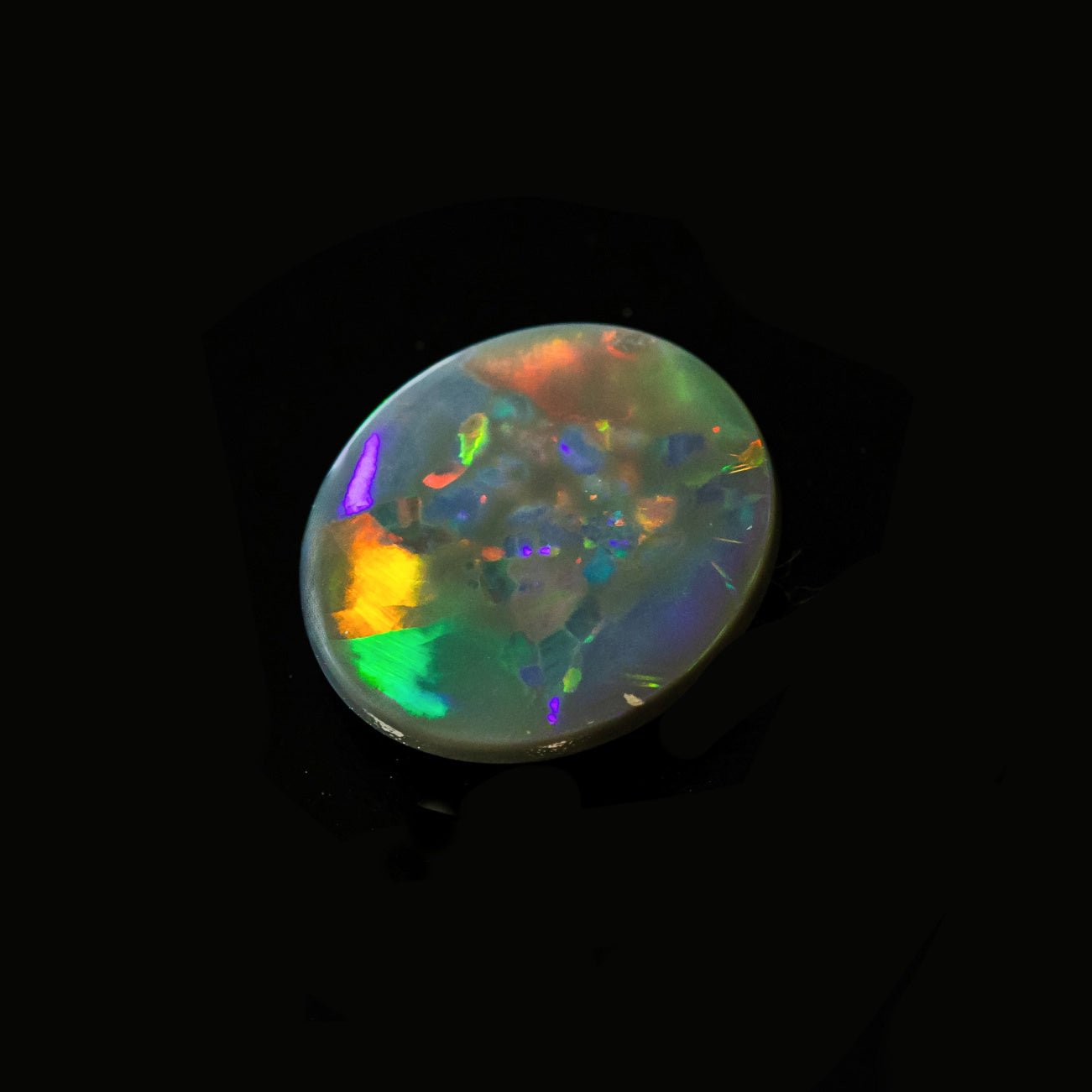 Natural Lightning Ridge opal featuring red, green, and blue flashes