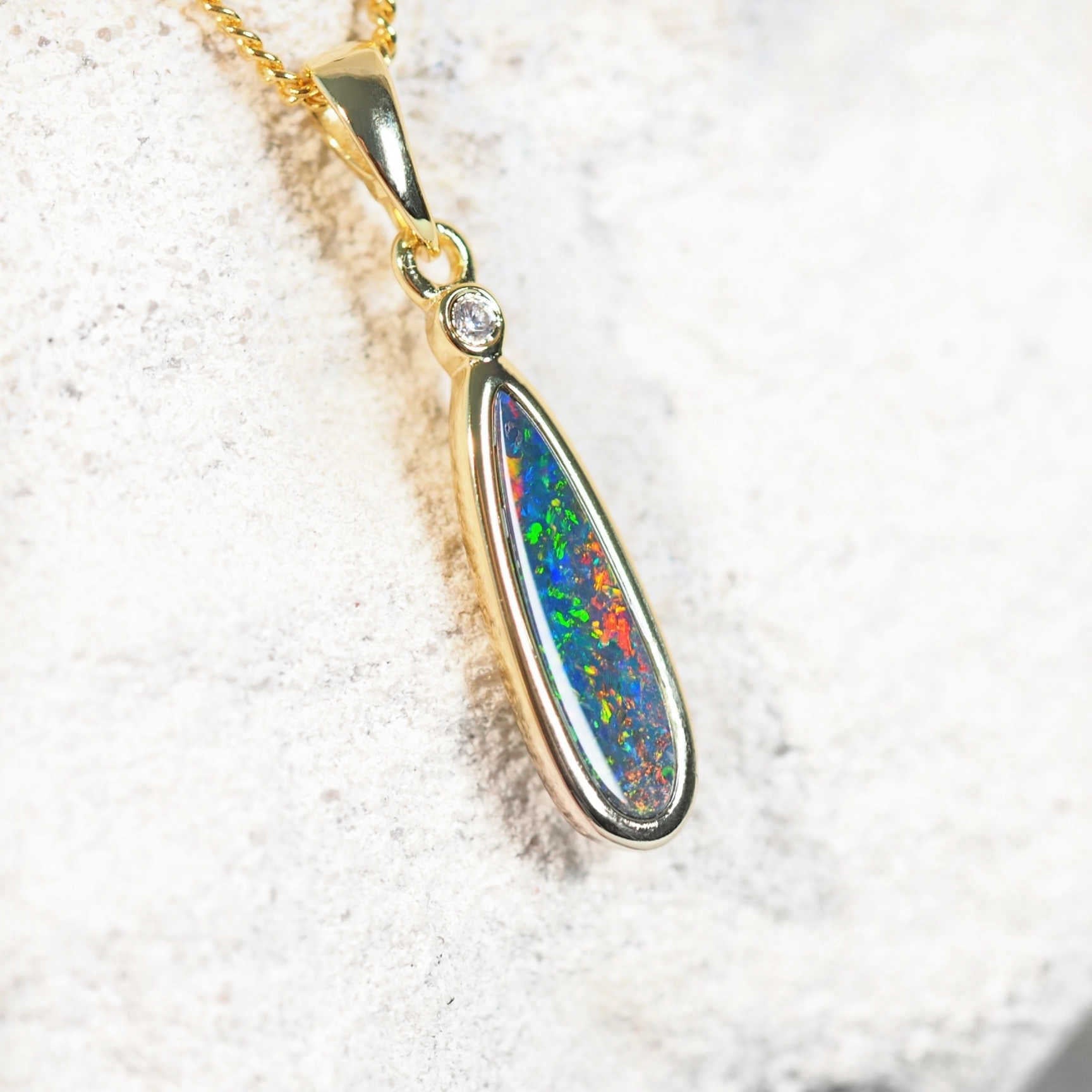 australian opal pendant with a shiny diamante