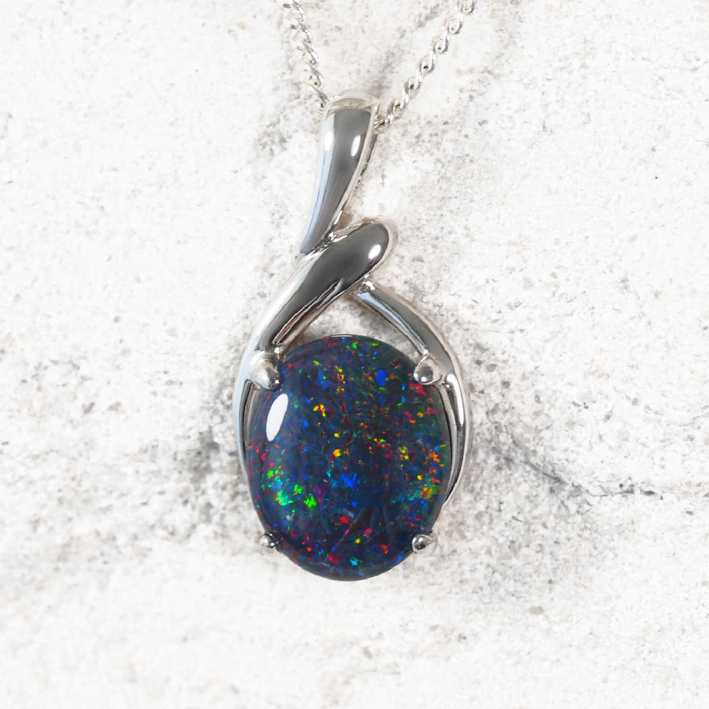 Sterling silver opal necklace pendant featuring oval multi-coloured Australian triplet opal with vibrant play-of-colour