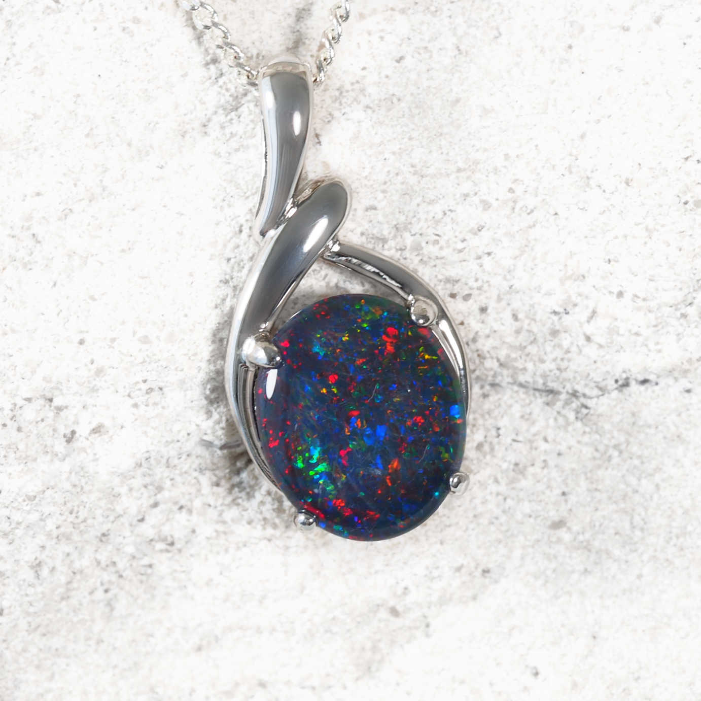 ‘Sahar’ sterling silver statement opal pendant with claw-set oval Australian triplet opal in radiant multi-colour tones