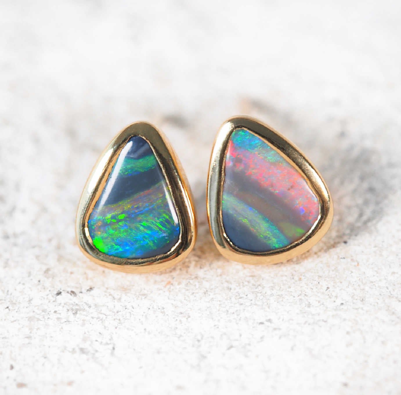 Lightning Ridge black opal earrings with vivid red, green, and blue hues