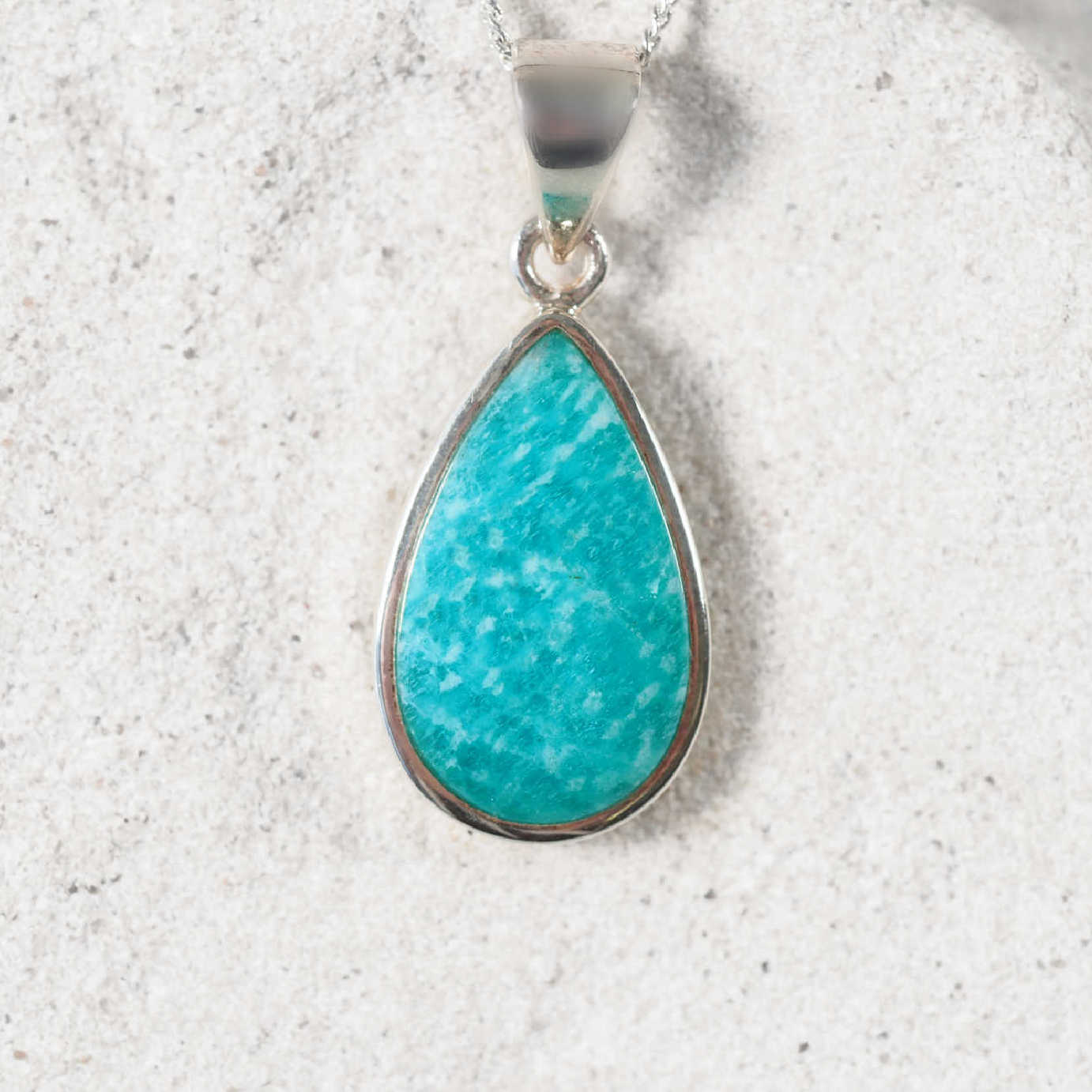 Amazonite 'Sasha' Silver pendant displaying bright blue hues with a silver frame securing the gemstone
