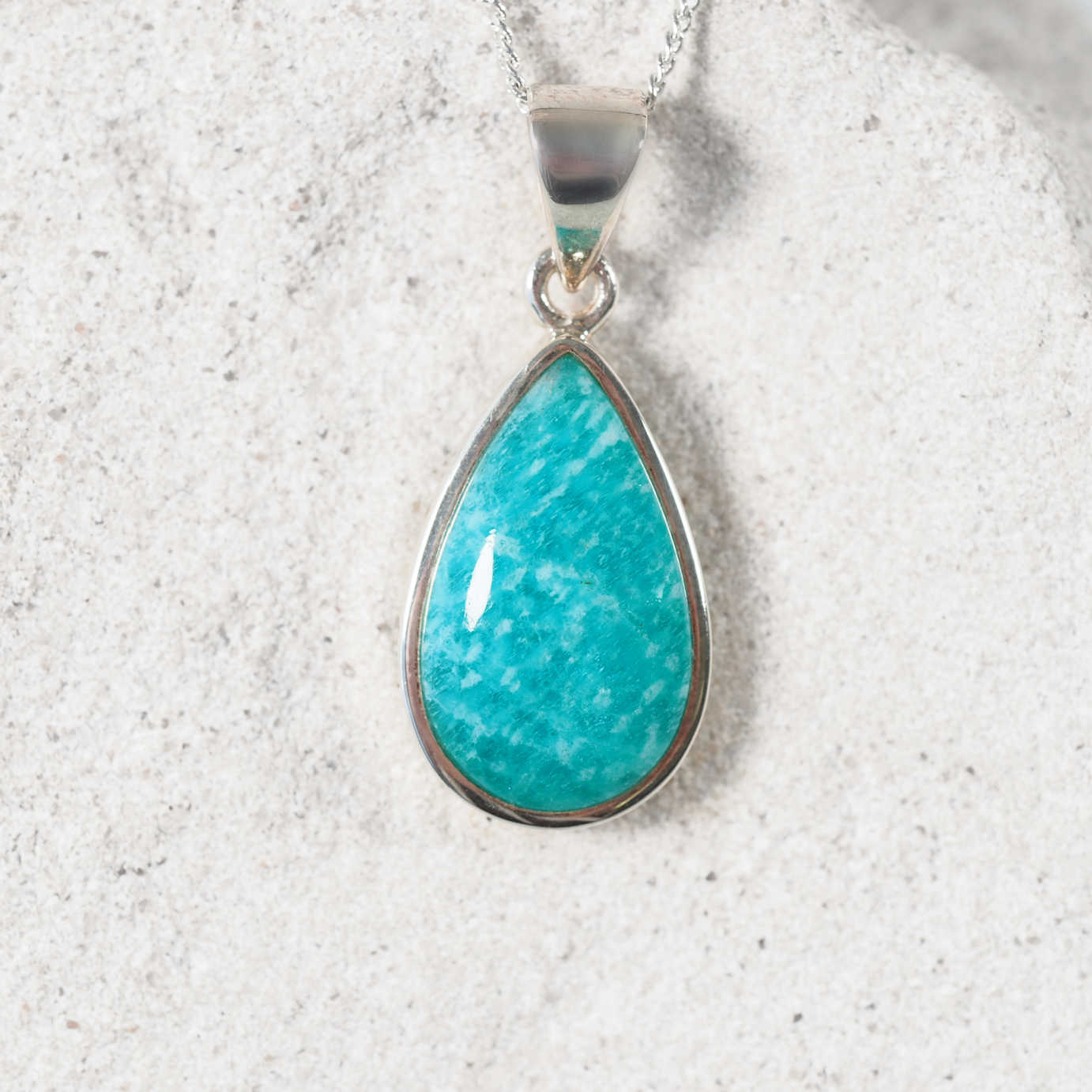 Amazonite 'Sasha' Silver pendant displaying bright blue hues with a silver frame securing the gemstone
