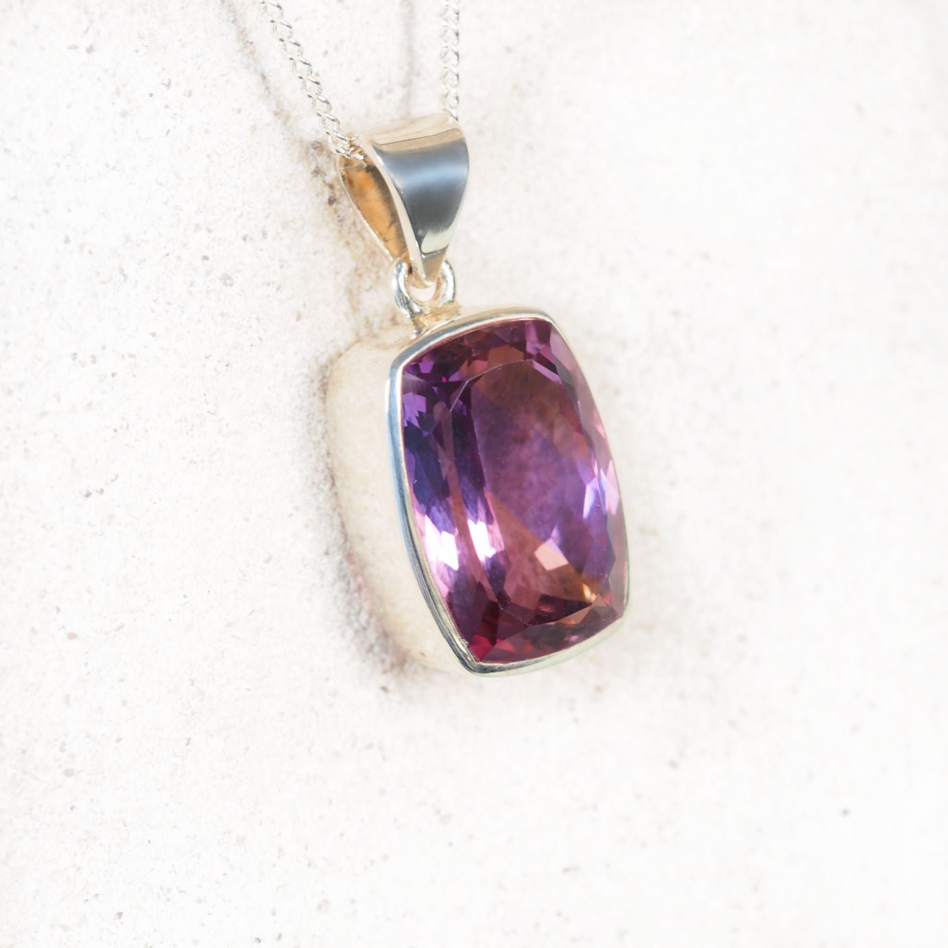 Amethyst Faceted Pendant in silver frame