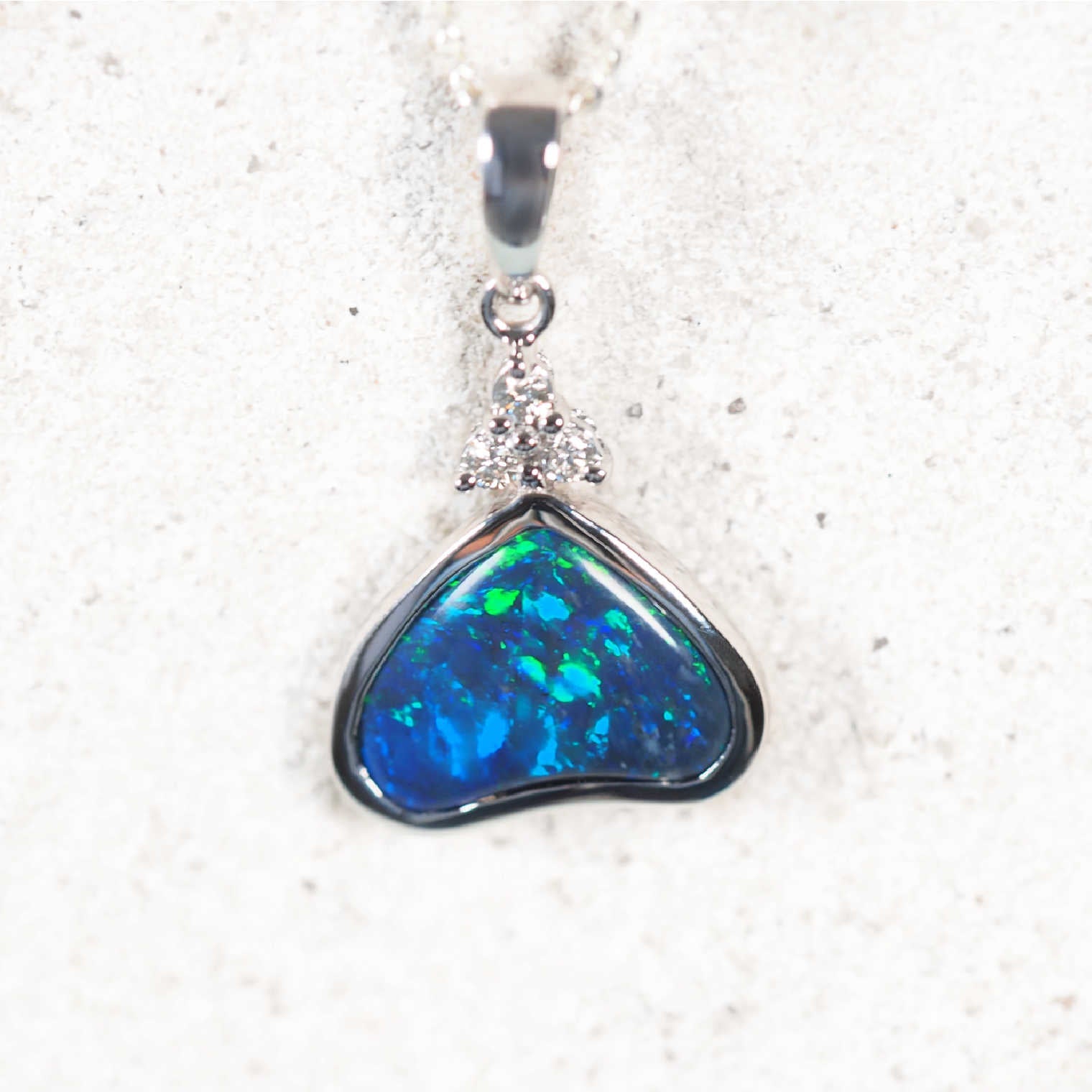 ‘Seren’ 18ct white gold black opal pendant – triangular Lightning Ridge opal with three diamonds by Black Star Opal