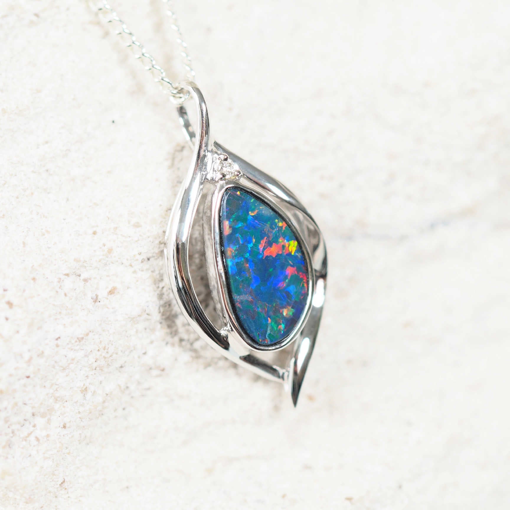 Serena opal necklace with vibrant freeform opal set in a sleek white gold bezel.